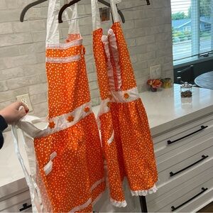 Set of 2 Handmade Vintage style Orange Polka Dot Aprons with White Trim Flower